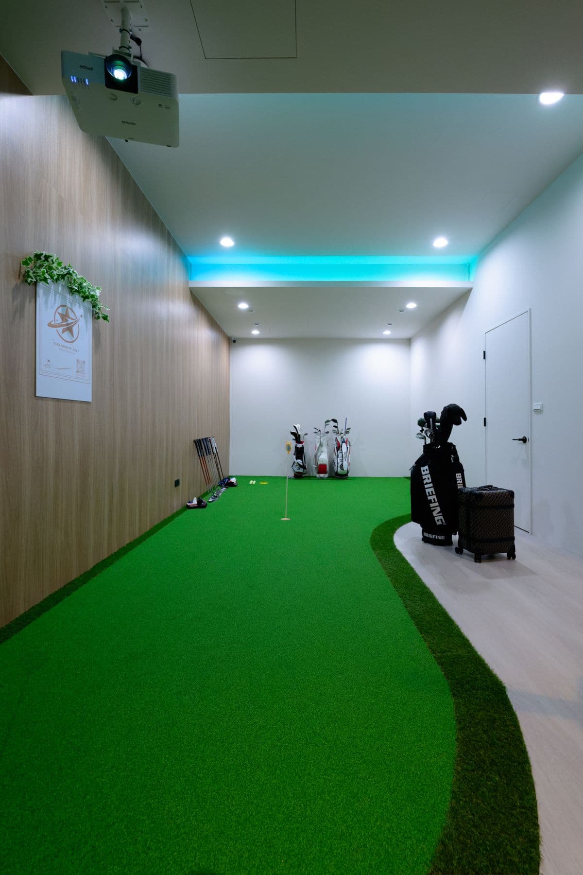 The studio's putting green corridor
